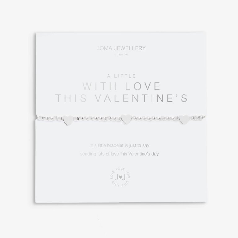 A Joma Jewellery A Little Bracelet with a sweet sentiment reading 'With Love this Valentine's'. Silver, Stretchable Bracelet with three small heart charms. Perfect for a Valentine's Day Gift